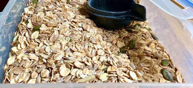 A tub of muesli with a serving thingy